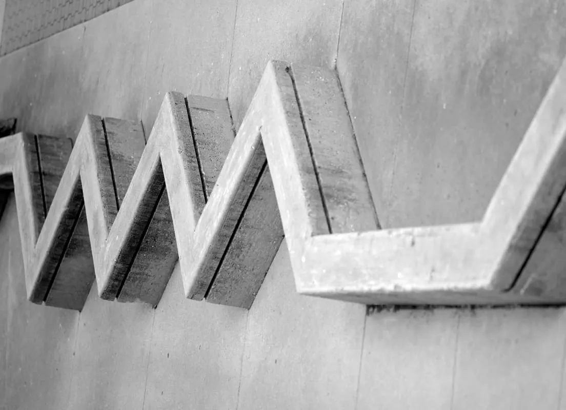 The zigzag concrete relief on a campus wall